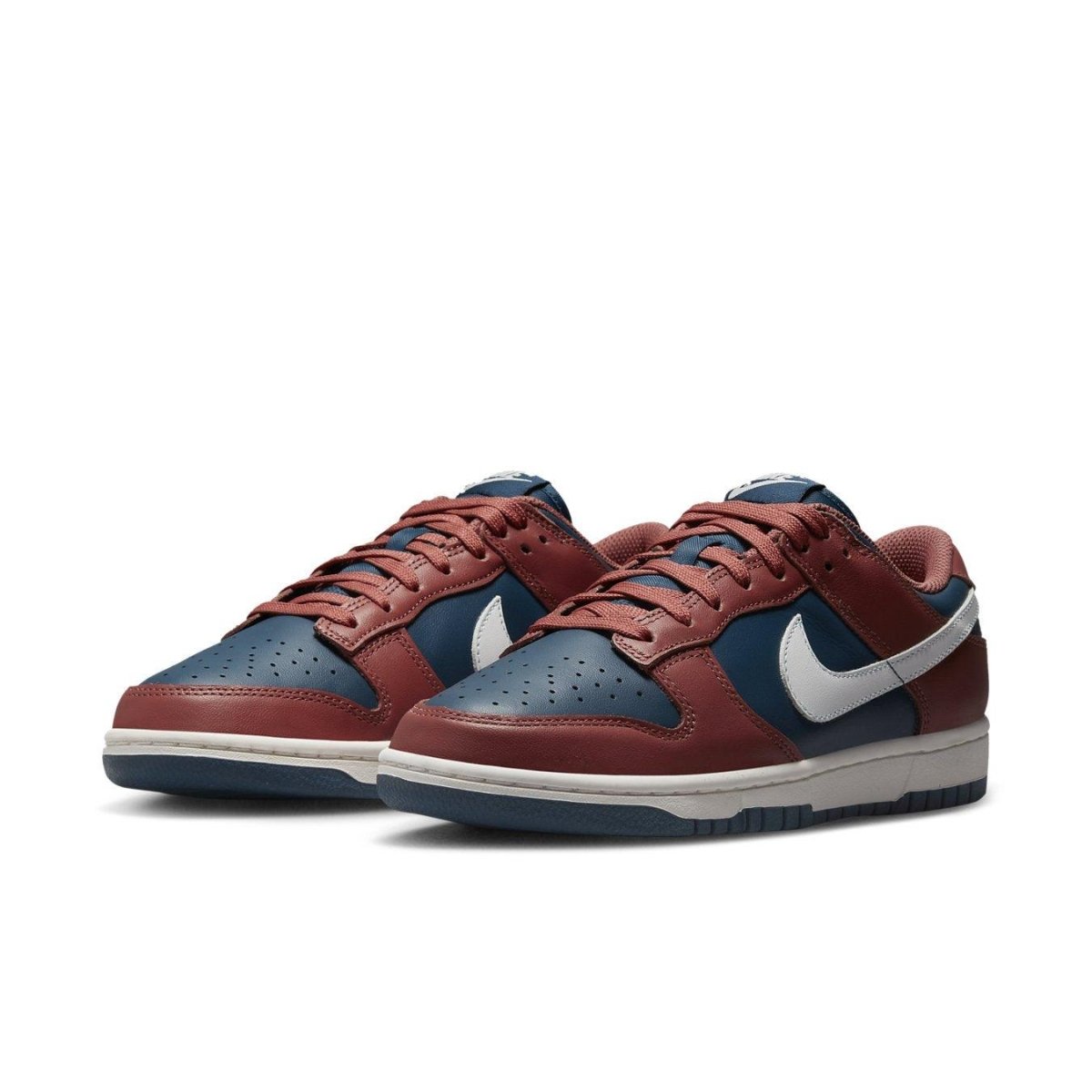 Nike Dunk Low Retro Canyon Rust in navy and rust leather with white Swoosh and midsole.