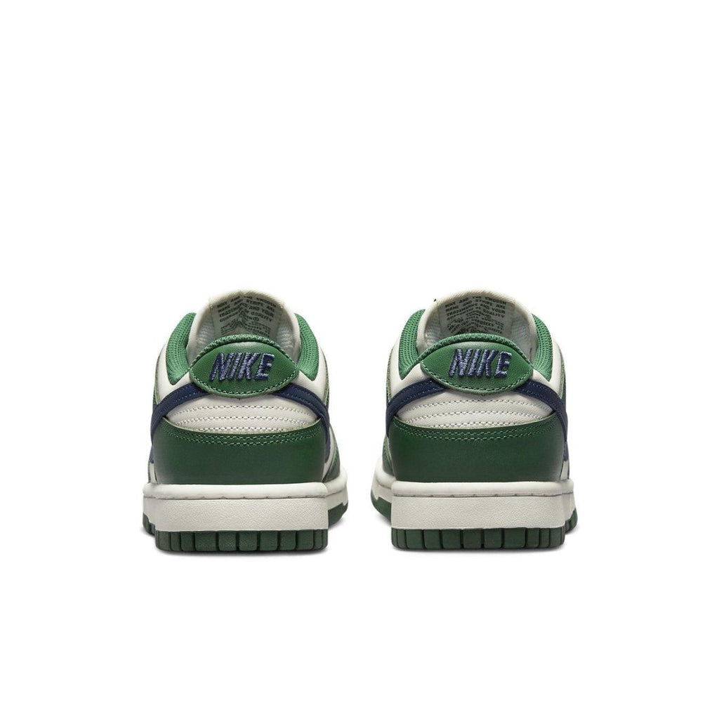 Nike Dunk Low Retro in Gorge Green and Midnight Navy, featuring a smooth white leather base and signature branding.