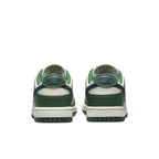 Nike Dunk Low Retro in Gorge Green and Midnight Navy, featuring a smooth white leather base and signature branding.