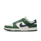 Nike Dunk Low Retro in Gorge Green and Midnight Navy for women, featuring a white leather base and signature Swoosh.