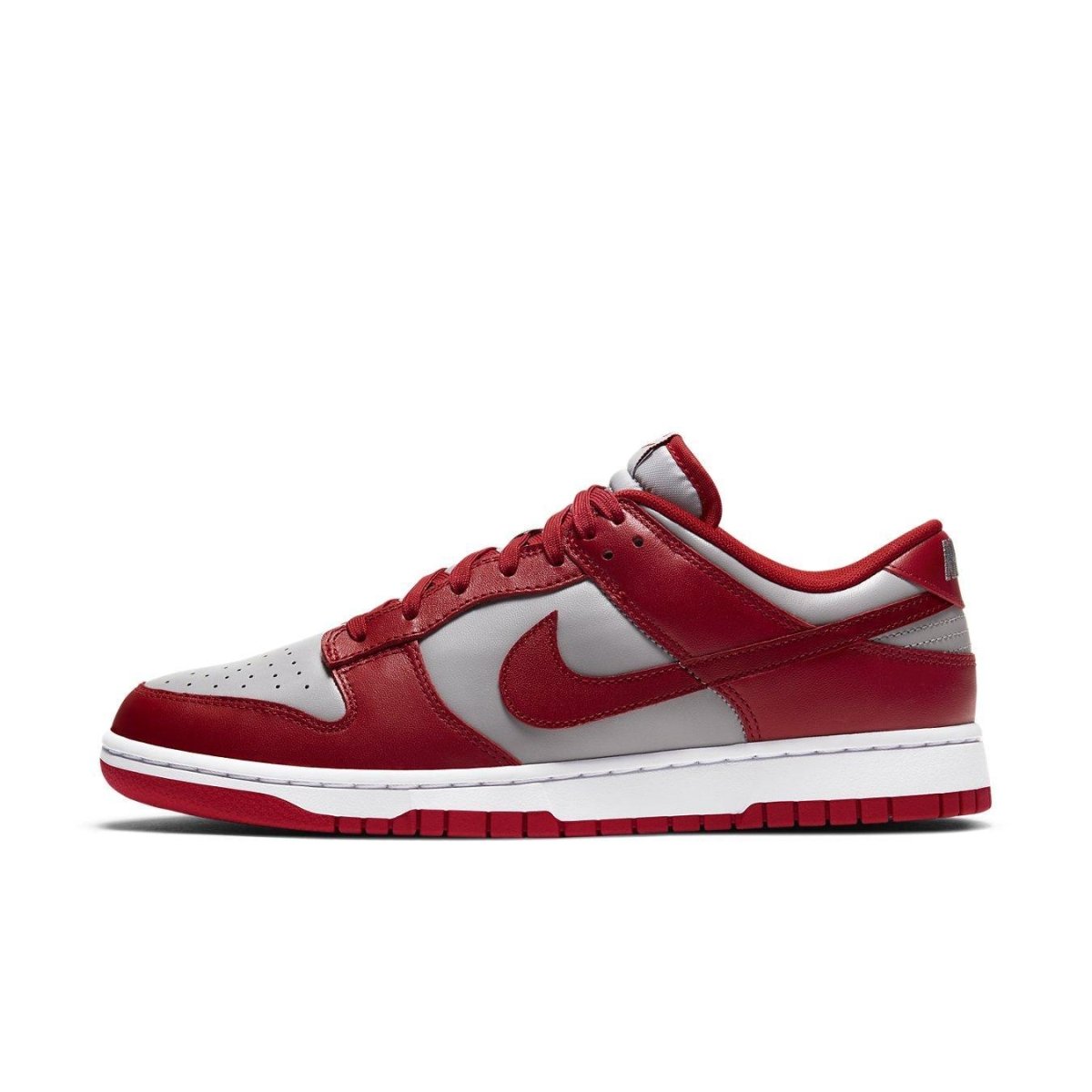 Nike Dunk Low Retro Medium Grey Varsity Red UNLV sneaker with leather upper in grey and red accents.