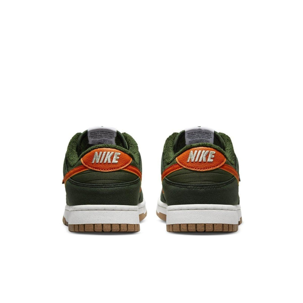 Nike Dunk Low Retro NN Toasty Sequoia sneakers showing back detail with green upper and orange accents.