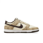 Nike Dunk Low Retro PRM Animal Pack in Giraffe/Cheetah colorway featuring premium materials and animal print design.