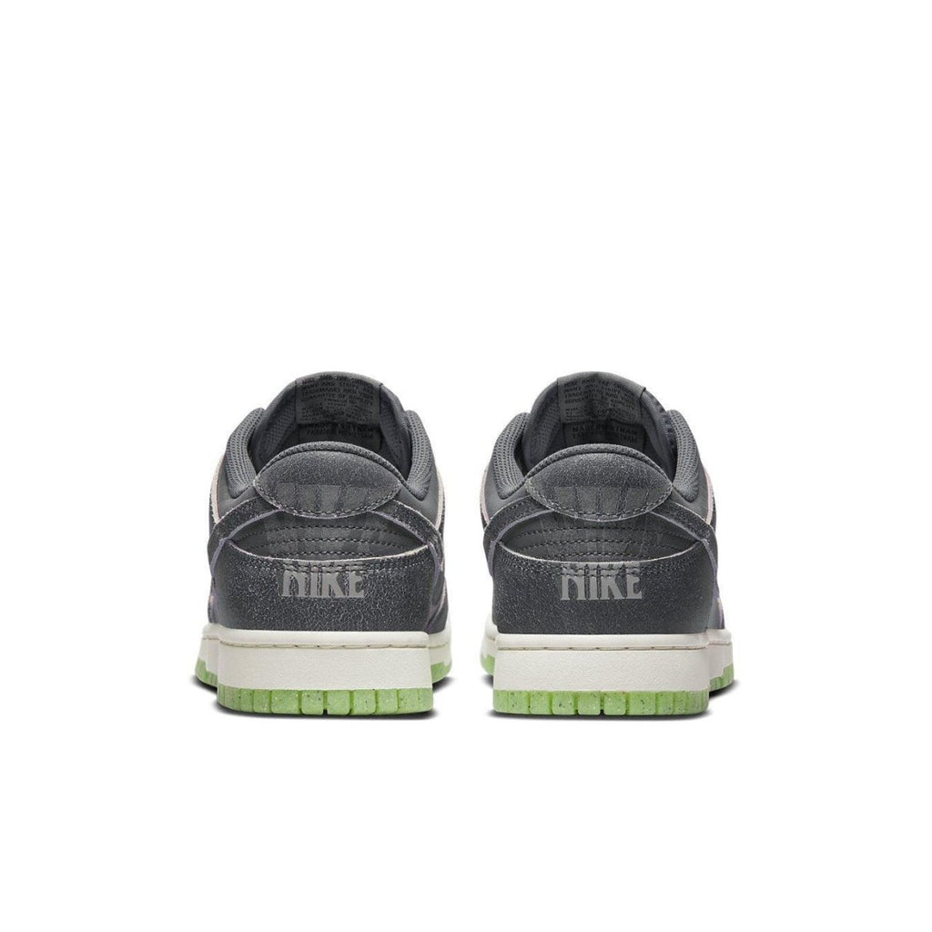 Nike Dunk Low Retro PRM Halloween 2022 sneaker rear view, featuring double Swoosh and eerie branding.
