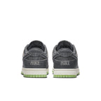 Nike Dunk Low Retro PRM Halloween 2022 sneaker rear view, featuring double Swoosh and eerie branding.