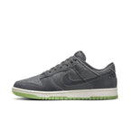Nike Dunk Low Retro PRM Halloween 2022 sneaker in dark gray with green sole, featuring unique double swoosh design.