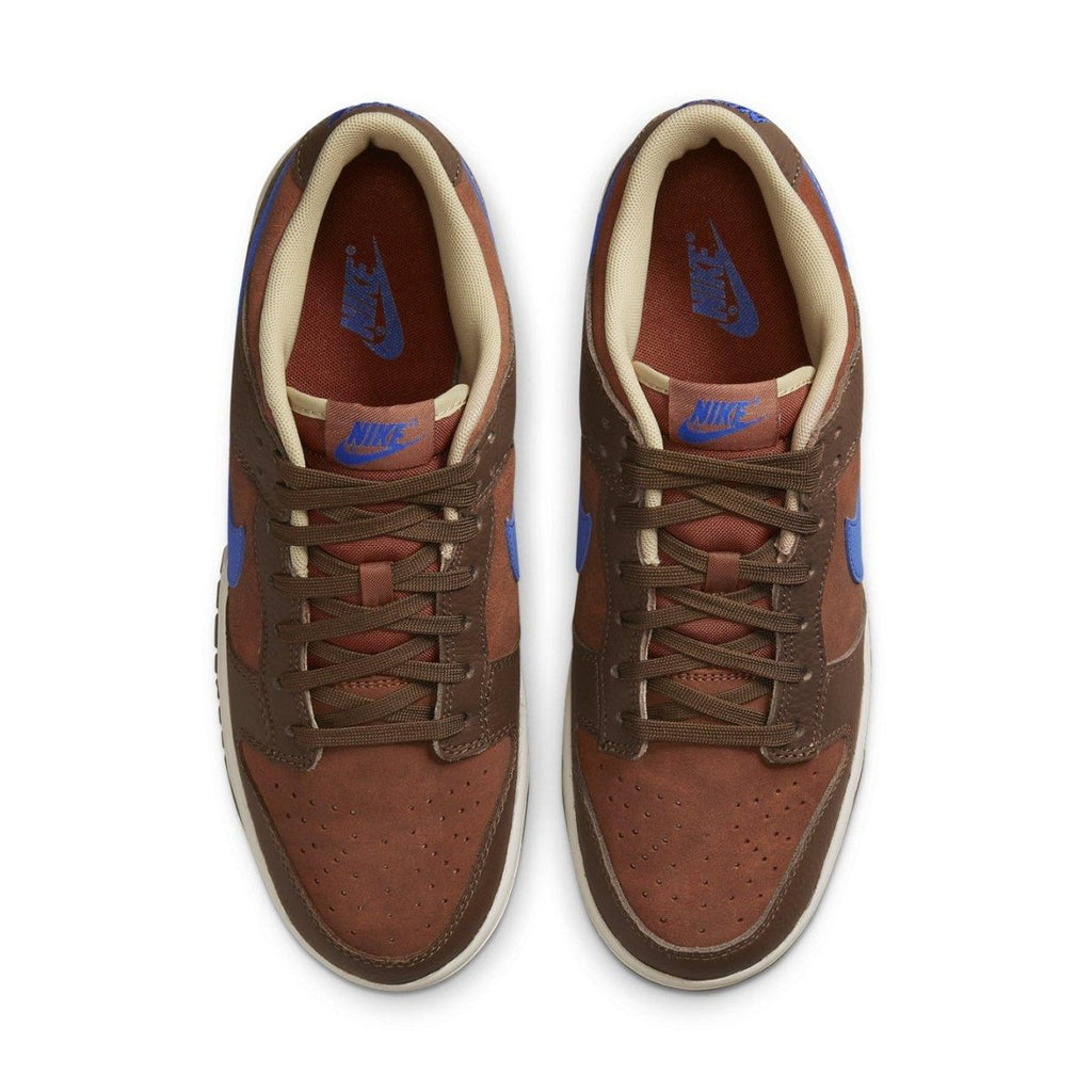 Nike Dunk Low Retro PRM Mars Stone sneakers featuring rust suede, brown accents, and Comet Blue Swoosh.