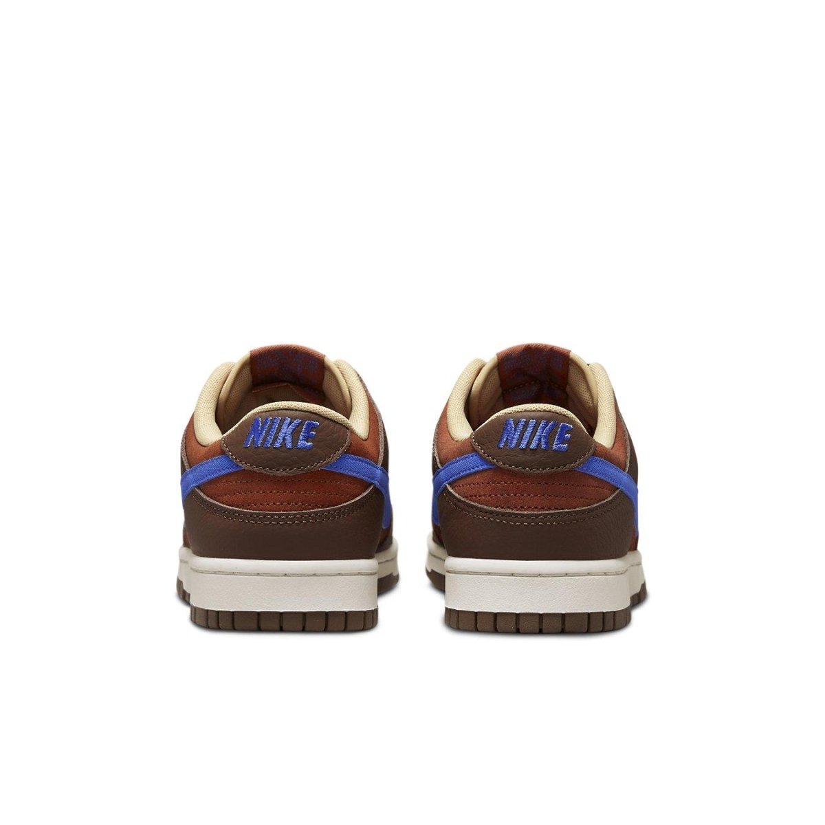 Nike Dunk Low Retro PRM Mars Stone sneakers, featuring rust suede, brown leather, and blue Swoosh at the back.