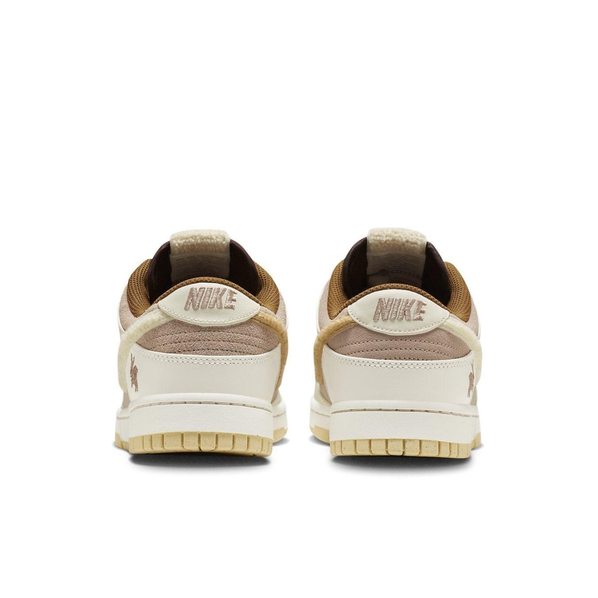 Nike Dunk Low Retro PRM Year of the Rabbit Fossil Stone sneakers, featuring unique back design and Swoosh branding.