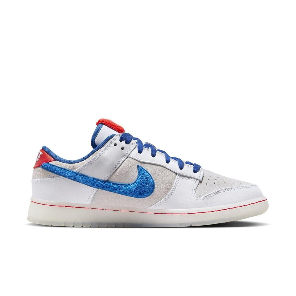 Nike Dunk Low Retro PRM Year of the Rabbit with white suede, blue Swoosh, and red accents celebrating Lunar New Year.