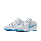 Nike Dunk Low Retro Pure Platinum Blue Lightning sneakers featuring a grey leather upper with blue accents.