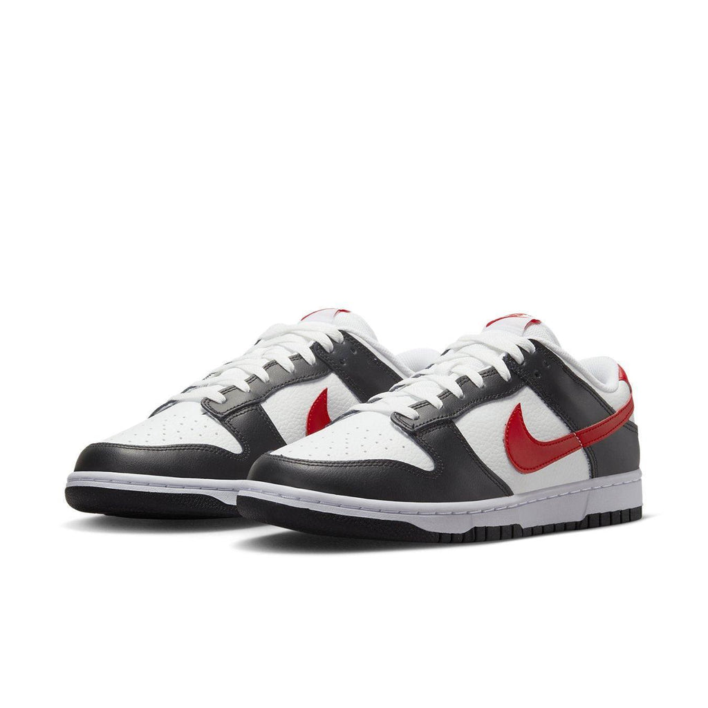 Nike Dunk Low Retro Red Swoosh Panda sneakers with a white and black leather upper and red Swoosh logo.