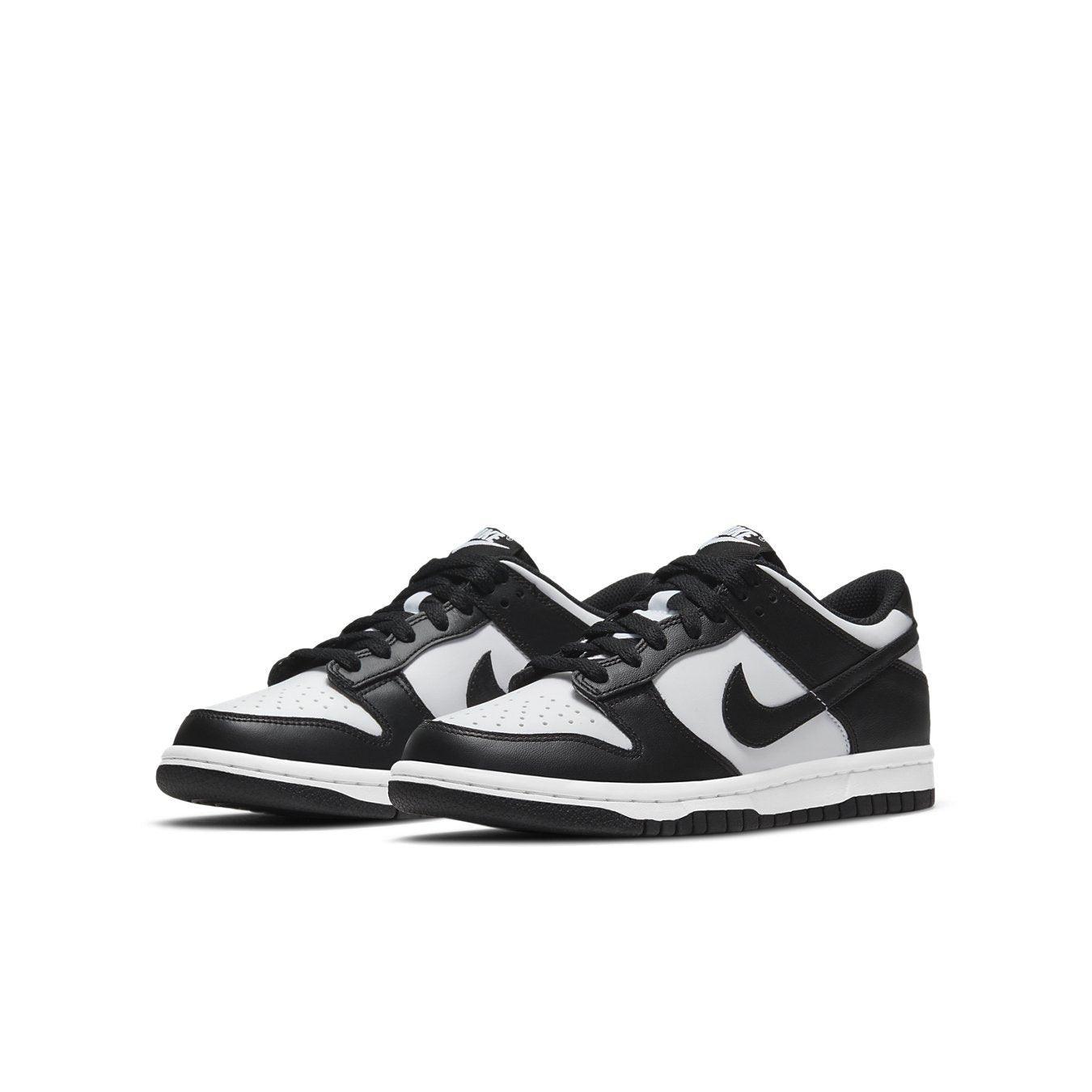 Nike Dunk Low Retro White Black GS sneakers featuring a white and black leather design for kids.