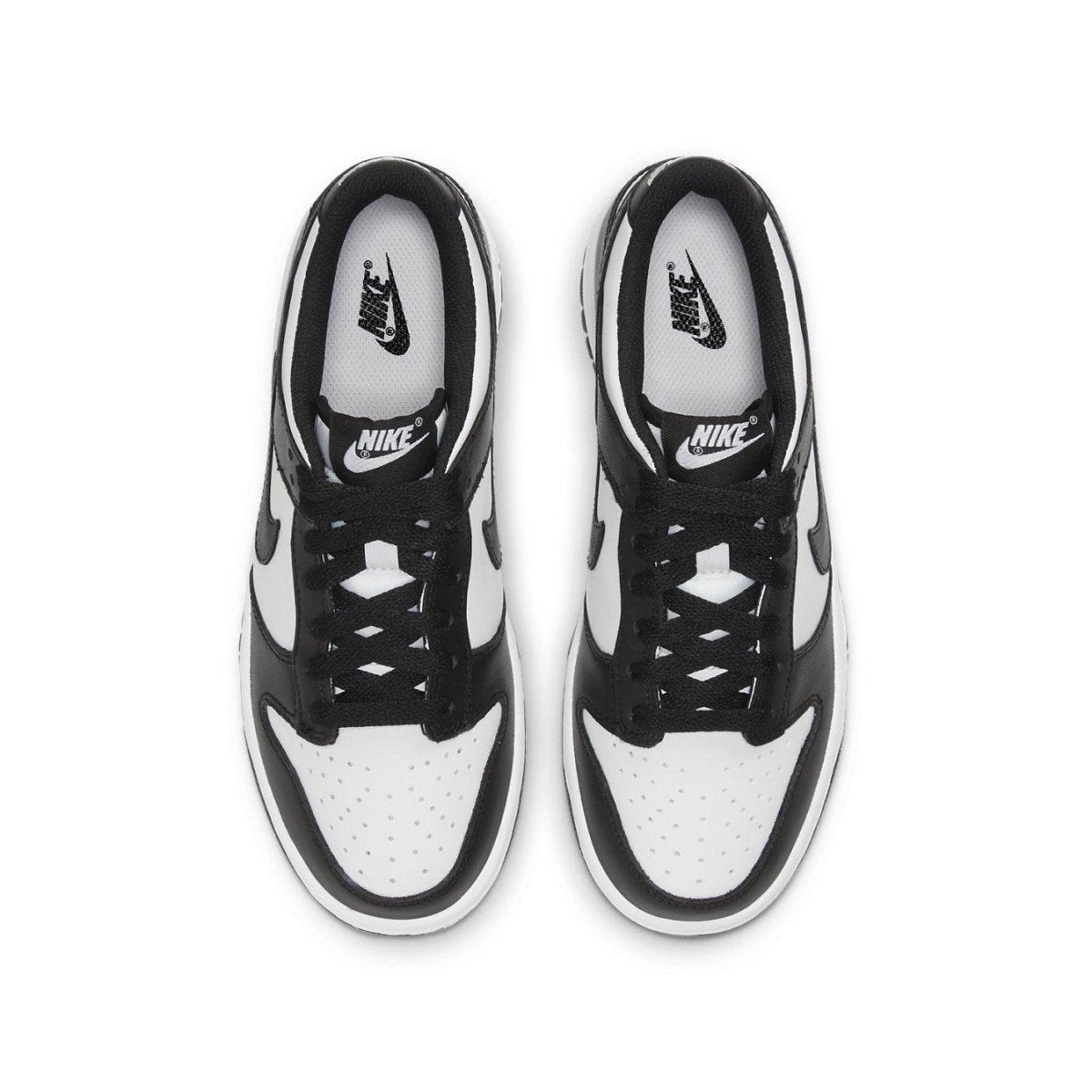 Nike Dunk Low Retro White Black GS sneakers with black and white leather upper, designed for kids.