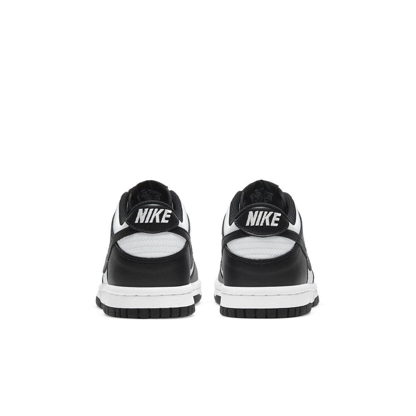 Nike Dunk Low Retro White Black GS sneaker rear view, featuring black and white leather design.
