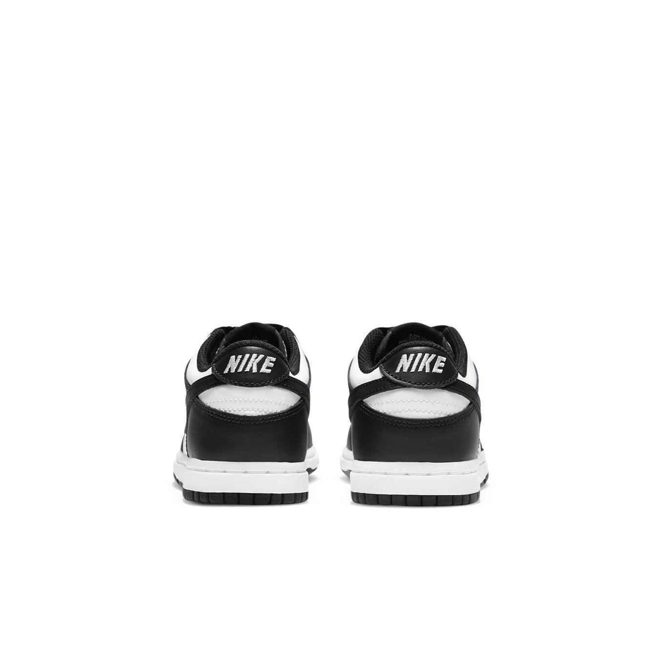 Back view of Nike Dunk Low Retro White Black Panda sneakers for kids, featuring black and white colorway and iconic design.