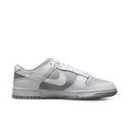 Nike Dunk Low Retro in White and Grey, showcasing a timeless sneaker design with classic color blocking.
