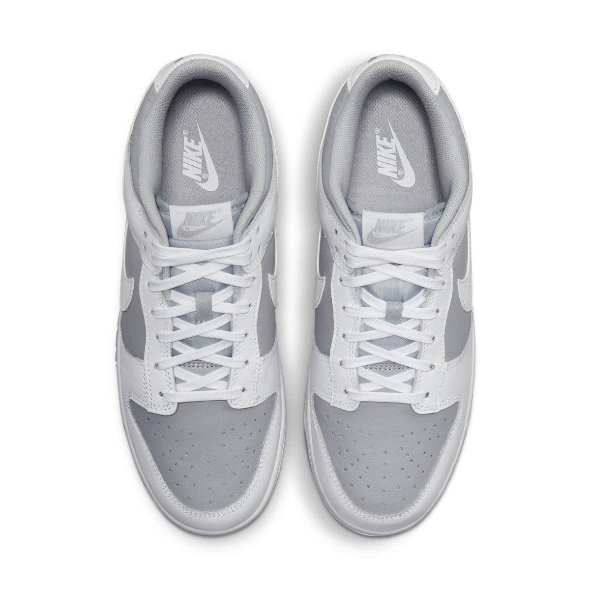 Nike Dunk Low Retro White Grey sneakers, featuring white and grey colorway with classic design.