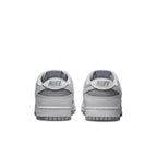 Nike Dunk Low Retro White Grey sneaker rear view showcasing the stylish grey design and branding details.