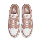 Nike Dunk Low Rose Whisper Women's sneakers with a pink and white color scheme, top view showing the laces and logo.