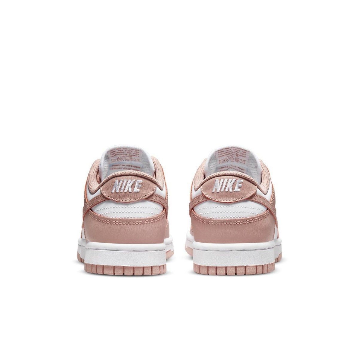 Nike Dunk Low Rose Whisper (W) sneakers showing the back view with soft pink hues and classic Nike branding.