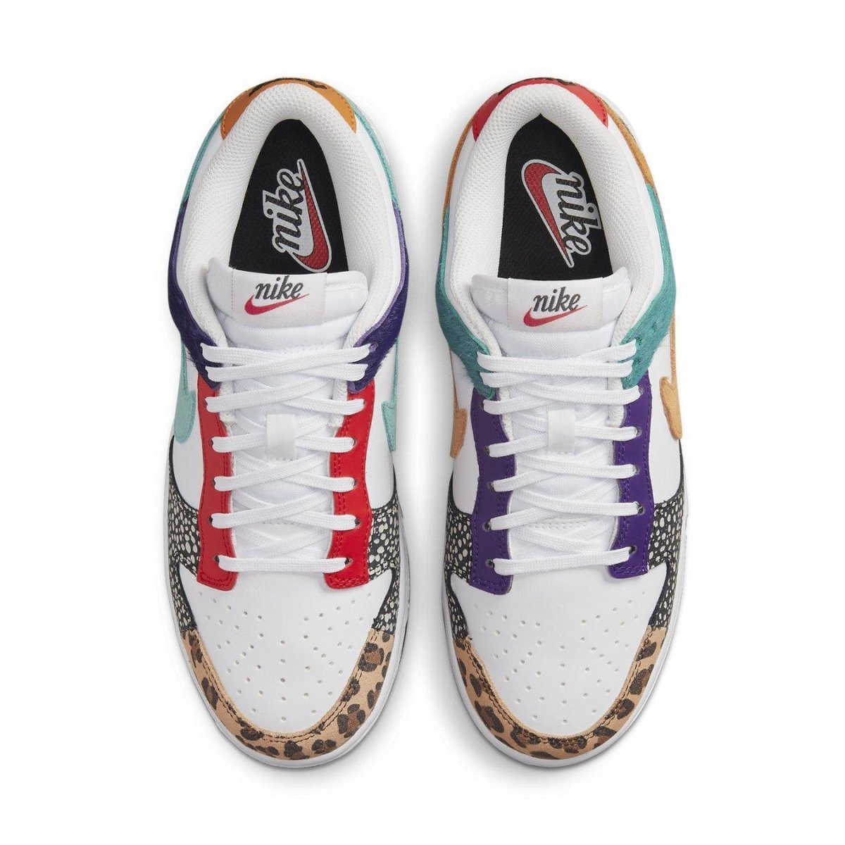 Nike Dunk Low Safari Mix (W) with white leather base and safari print overlays, featuring leopard Swooshes and contrasting laces.