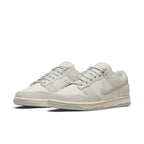Nike Dunk Low Sail Light Bone Women's sneakers in a sleek beige colorway with classic design and modern style.