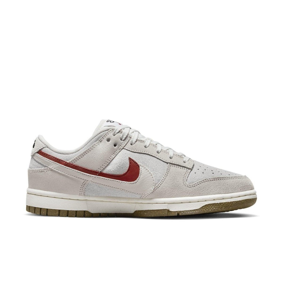 Nike Dunk Low SE 85 Sail Orange Women’s sneaker featuring suede upper and Grind rubber sole.