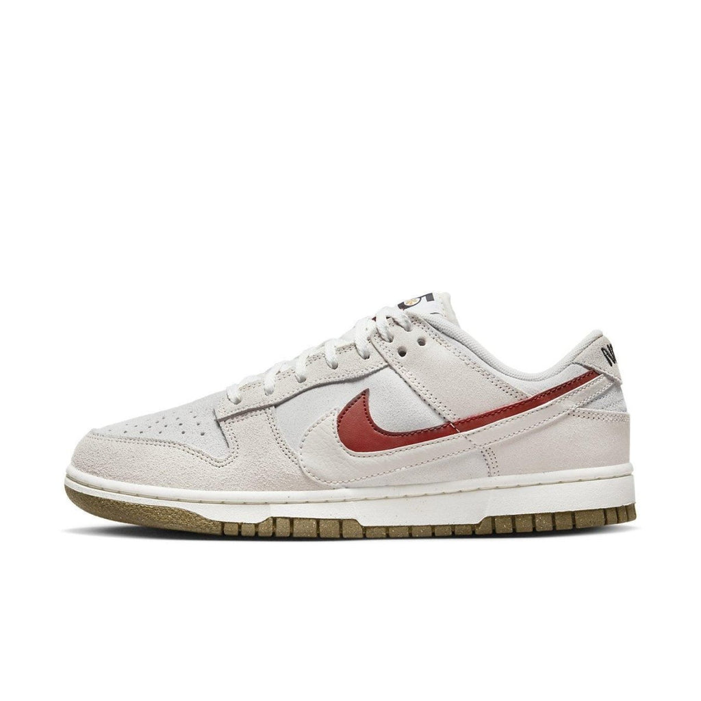 Nike Dunk Low SE 85 in Sail/Burnt Orange with suede upper and Grind sole, showcasing a stylish neutral design.