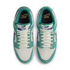 Top view of Nike Dunk Low SE 85 Neptune Green women's sneakers with teal and white design.