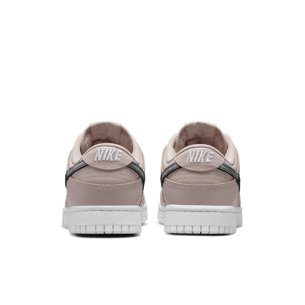 Rear view of Nike Dunk Low SE Animal Instinct Fossil Stone women's sneakers with signature logo.