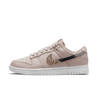 Nike Dunk Low SE Animal Instinct Fossil Stone Women's sneaker with animal print and metallic accents.