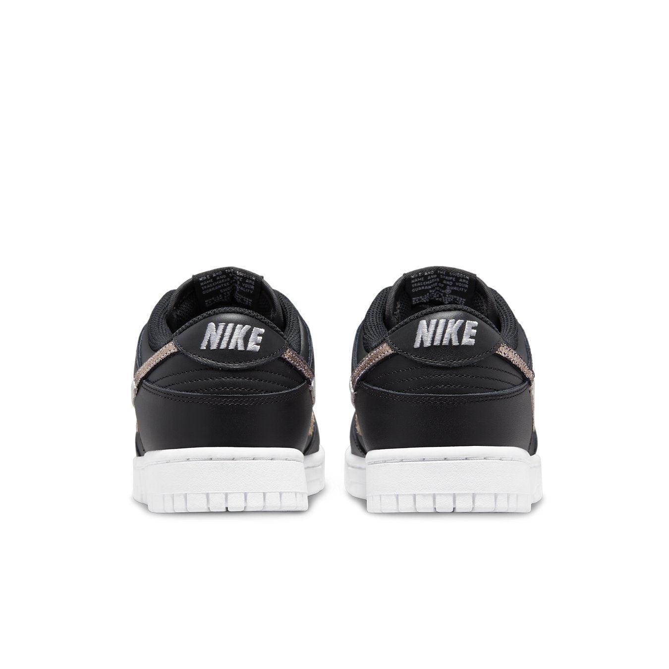 Nike Dunk Low SE Animal Instinct Black (W) rear view showcasing sleek black leather design and white sole.