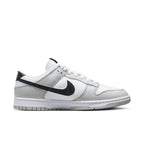 Nike Dunk Low SE Lottery Pack in Grey Fog with white leather upper and black Swoosh, stylish and classic sneaker design.
