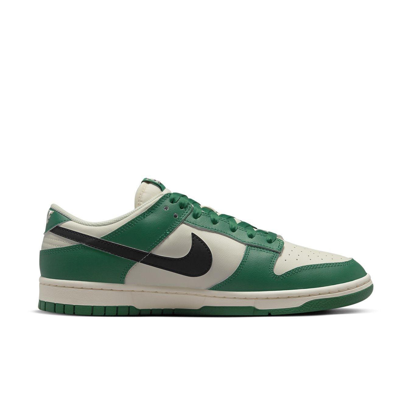 Nike Dunk Low SE Lottery Pack in Malachite Green with black Swoosh and ivory leather accents.
