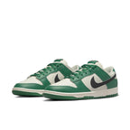 Nike Dunk Low SE Lottery Pack Malachite Green sneakers featuring green and ivory leather with a black Swoosh.