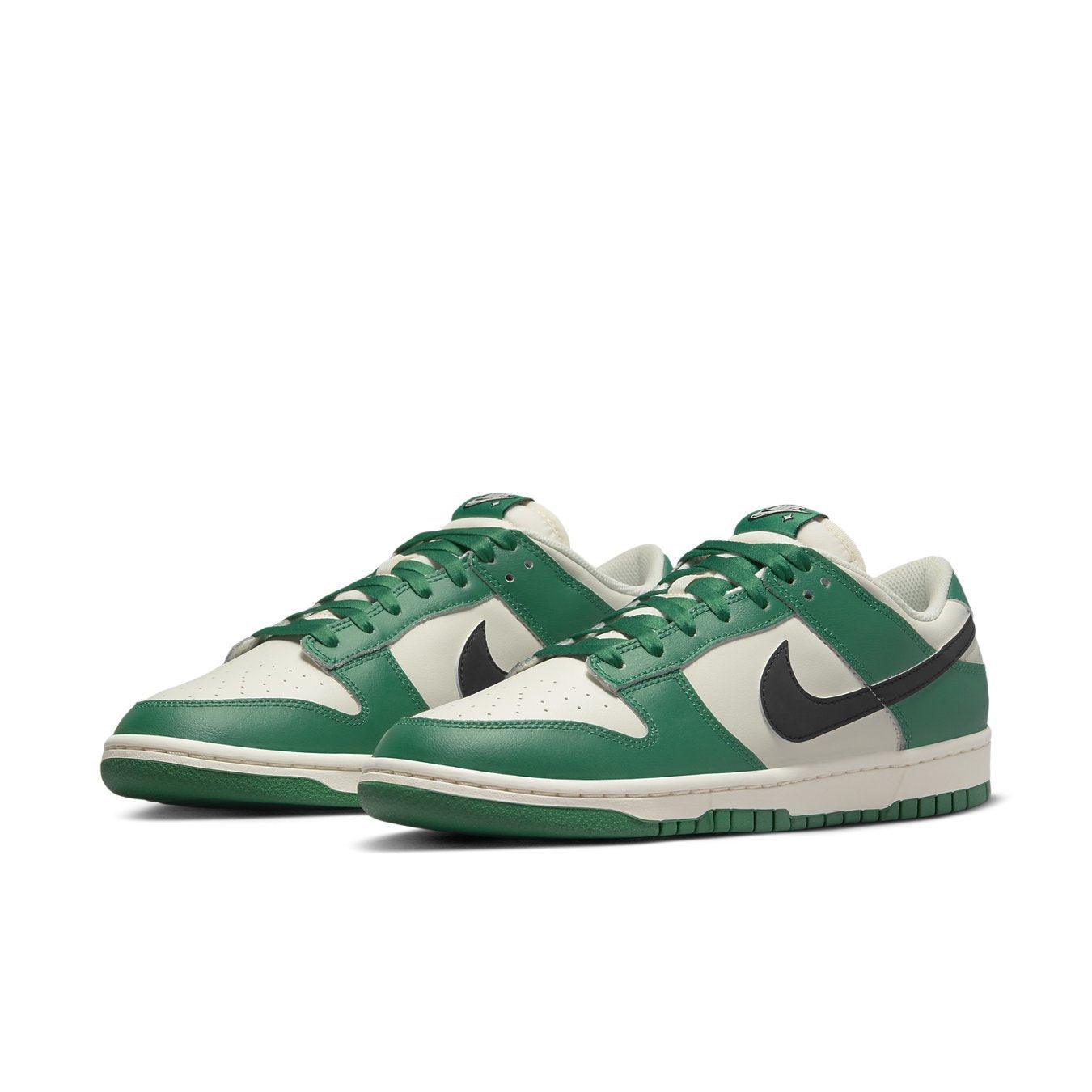 Nike Dunk Low SE Lottery Pack Malachite Green sneakers featuring green and ivory leather with a black Swoosh.