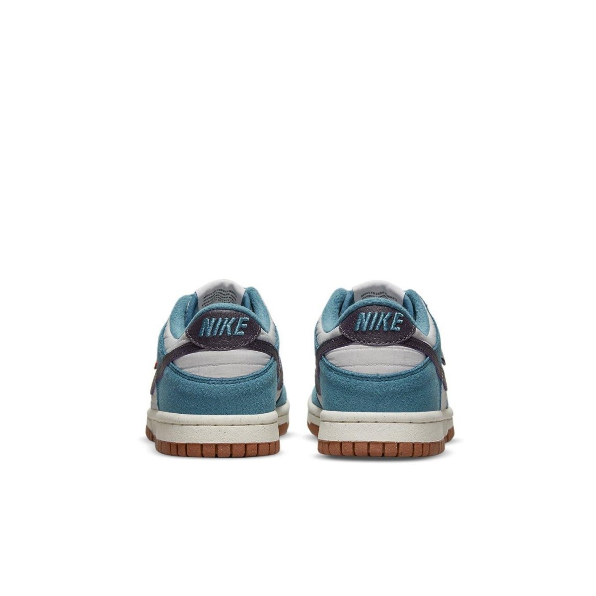Nike Dunk Low SE Toasty Rift Blue GS sneakers, showing the back view with blue suede and Nike logo on the heel.