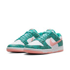 Nike Dunk Low Snakeskin in Washed Teal and Bleached Coral with snake print and rubber sole design.
