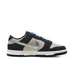 Nike Dunk Low Starry Laces (W) in Light Bone and black with silver Swoosh and blue laces.