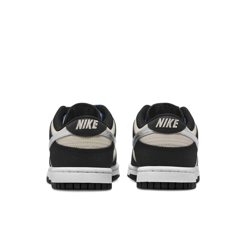 Nike Dunk Low Starry Laces W rear view showcasing sleek black and cream design with metallic Swoosh.