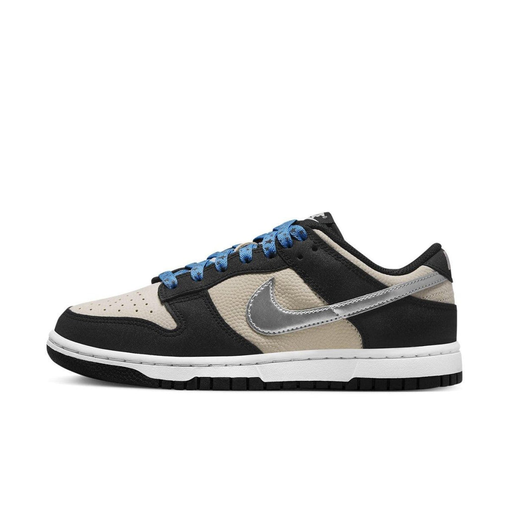 Nike Dunk Low Starry Laces (W) features a cream and black design with shiny silver Swoosh and blue laces.