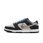Nike Dunk Low Starry Laces (W) features a cream and black design with shiny silver Swoosh and blue laces.