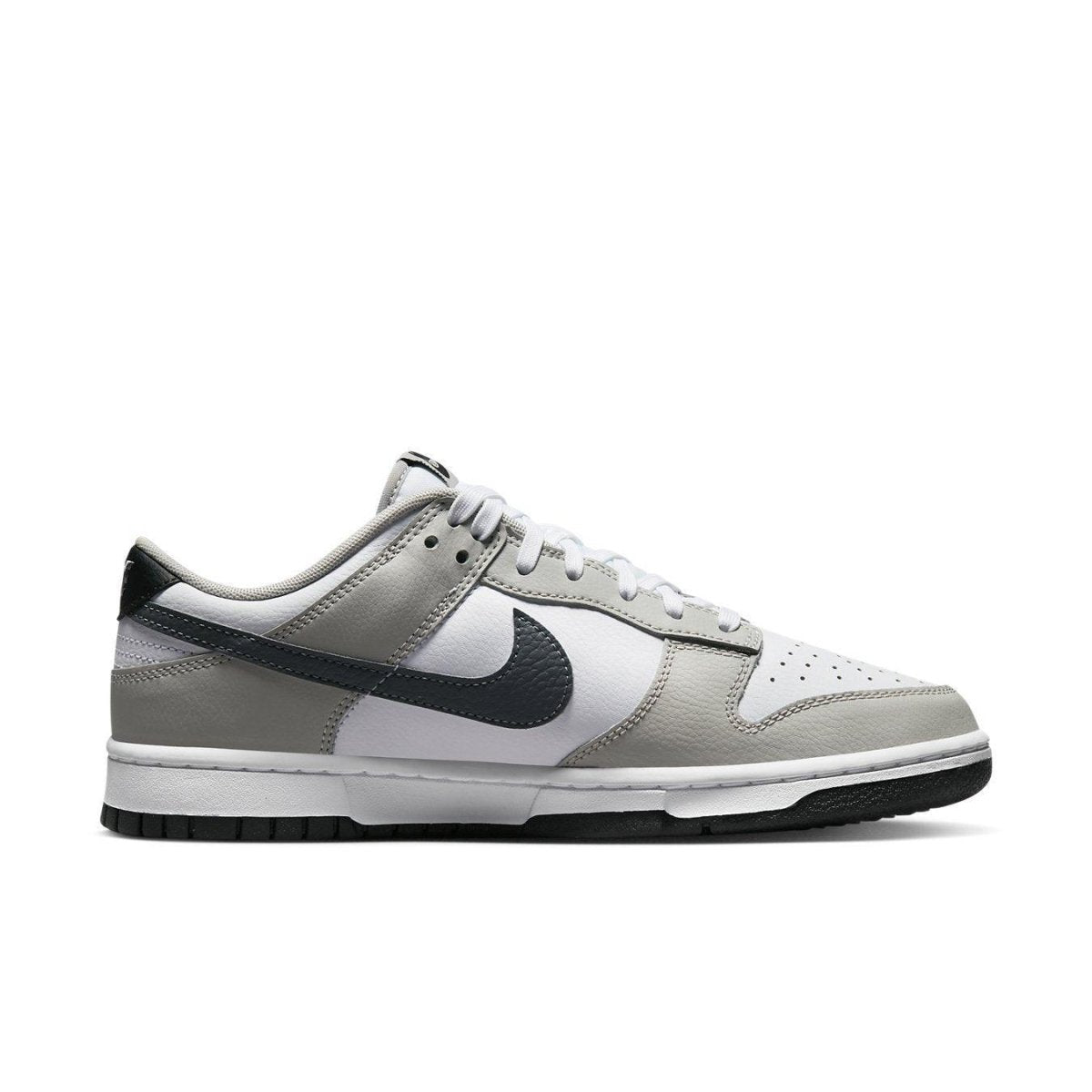 Nike Dunk Low Stencil Swoosh in grey and white with double Swoosh design and smooth leather upper.