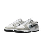 Nike Dunk Low Stencil Swoosh Grey White sneaker with double Swoosh design and smooth leather upper.