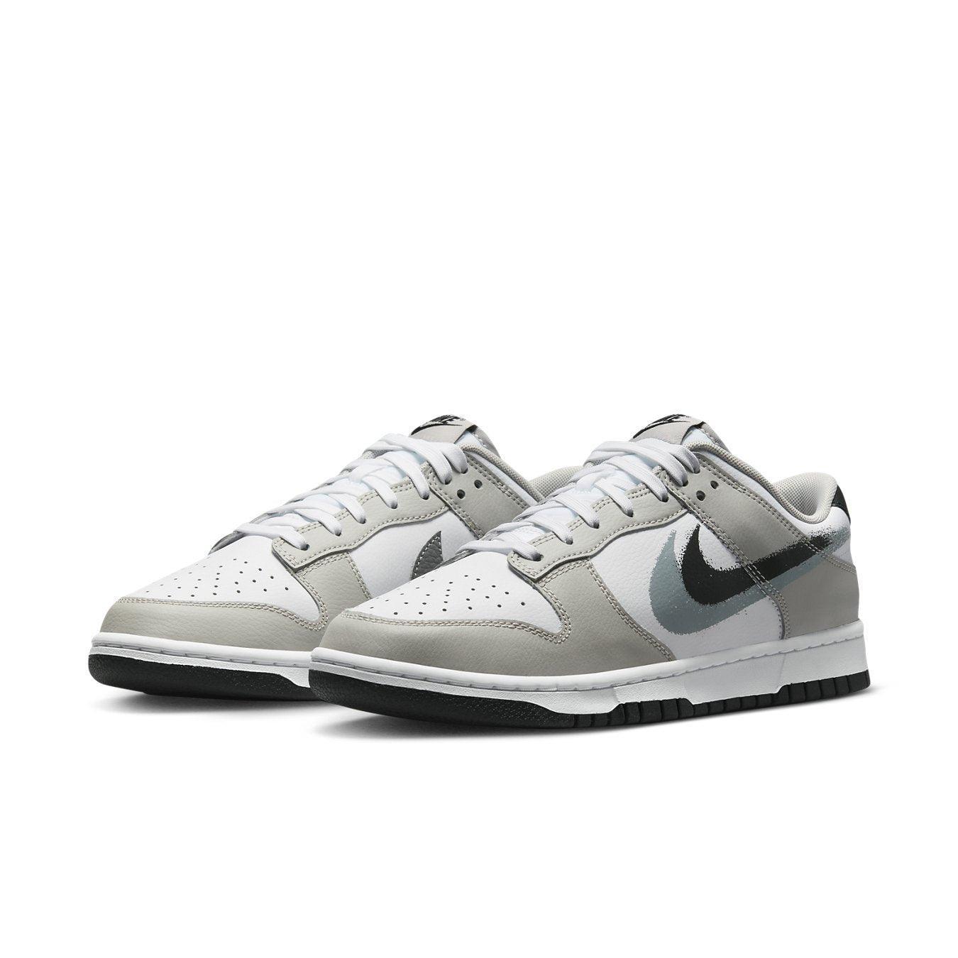 Nike Dunk Low Stencil Swoosh Grey White sneaker with double Swoosh design and smooth leather upper.