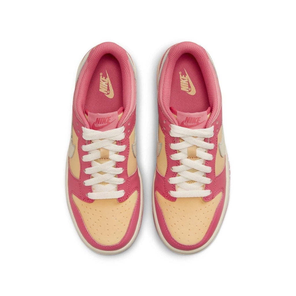 Nike Dunk Low Strawberry Peach Cream (GS) sneakers in pink and peach hues, featuring a white Swoosh and laces.