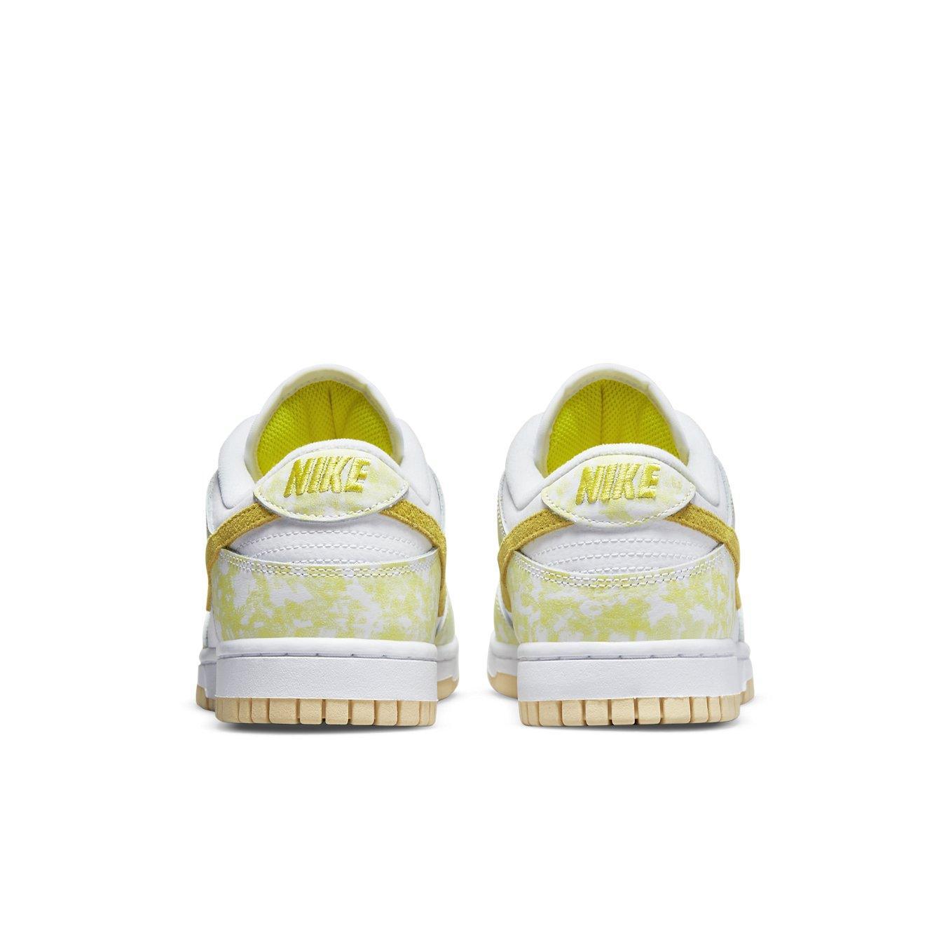 Nike Dunk Low Strike Yellow (W) women's sneakers, featuring white leather and vibrant yellow accents.