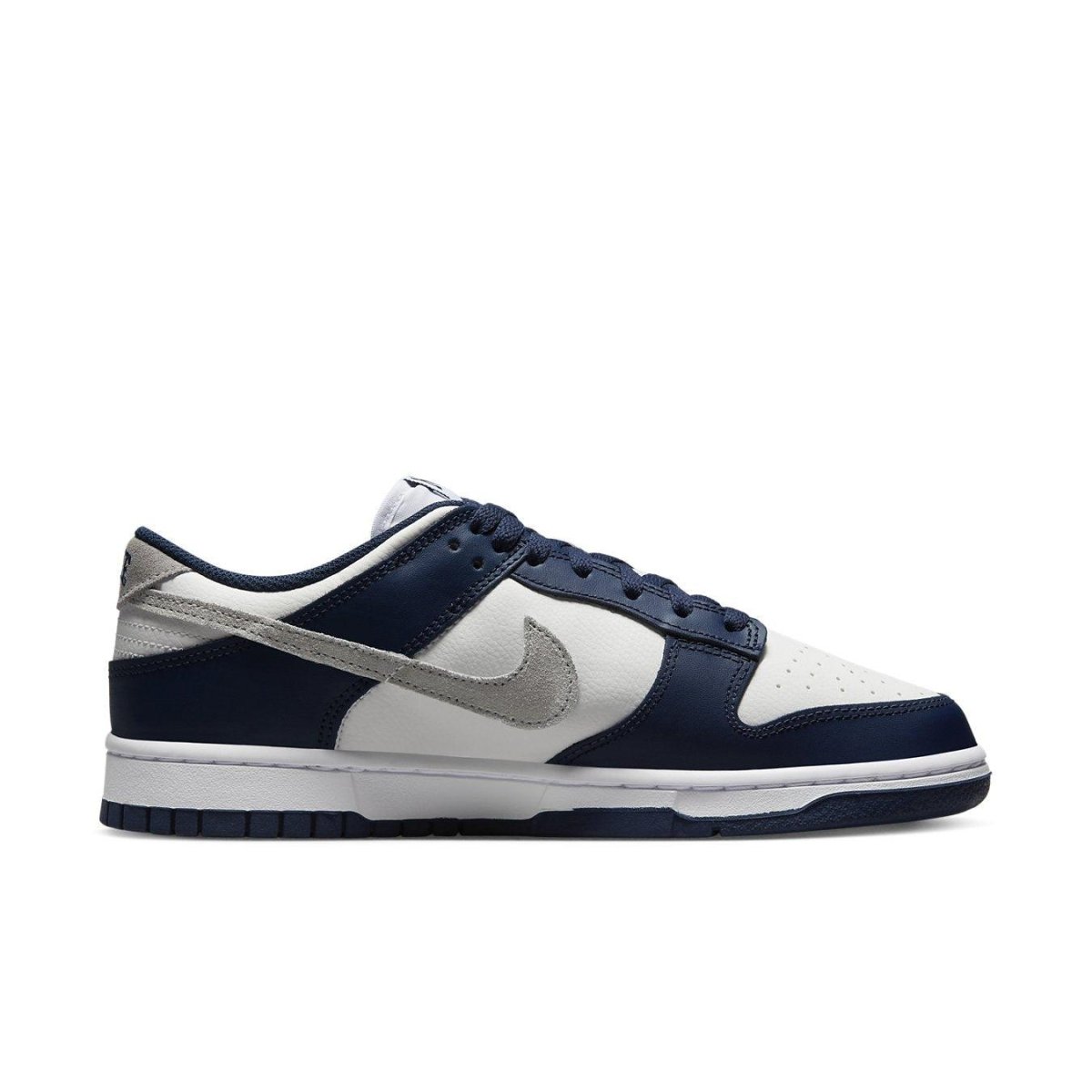 Nike Dunk Low Summit White Midnight Navy side view with leather upper and perforated toe.