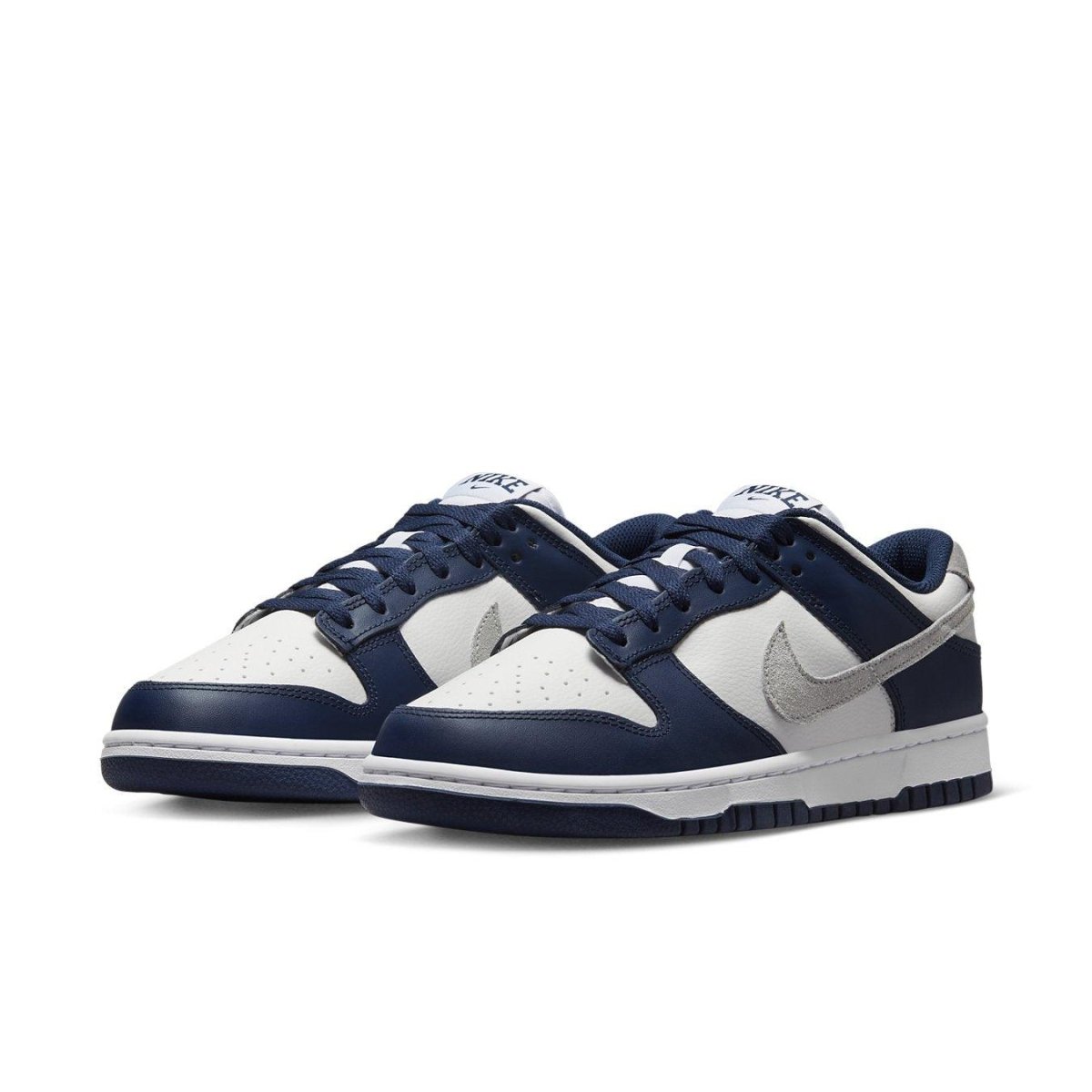 Nike Dunk Low Summit White Midnight Navy sneakers featuring leather design and perforated toe.